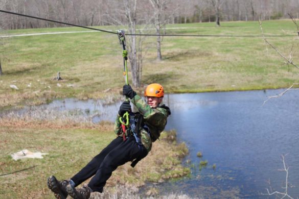 zipliner going over lake