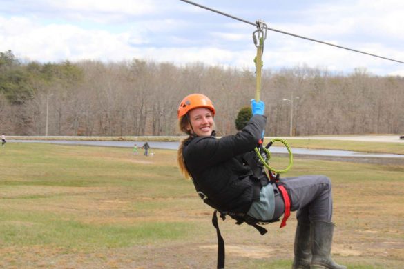 woman smiling during a zipline activity