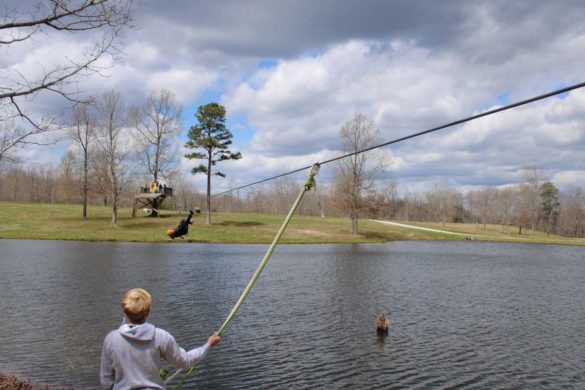 zipline instructor waiting for zipliner